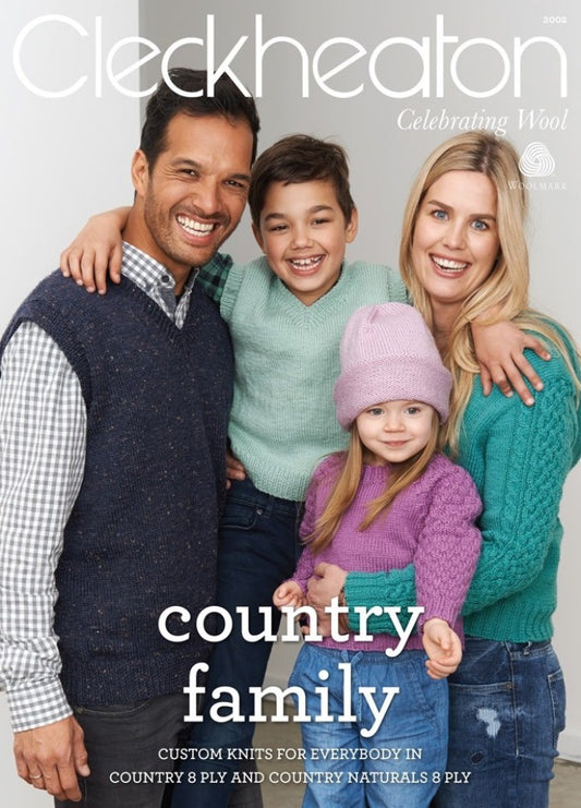 Smiling family in colorful knitwear on a magazine cover. Parents and two children, radiating warmth and happiness, promoting "Celebrating Wool."