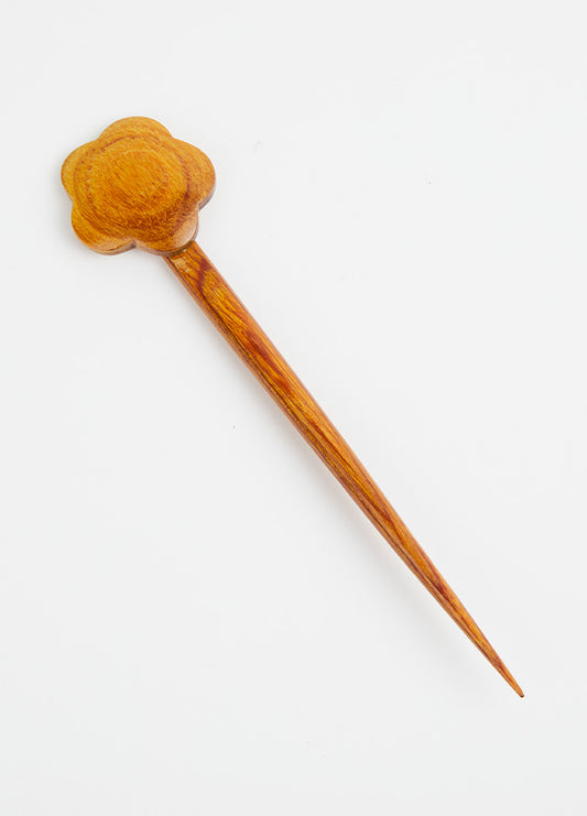 A beautifully crafted wooden hair comb with a floral accent, ideal for those who appreciate simple yet stylish hair ornaments