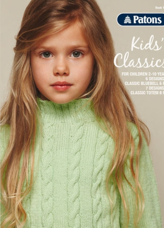 A young girl with long, blonde hair wears a pastel green cable-knit sweater. The text "Patons Kids' Classics" is visible on the beige background.