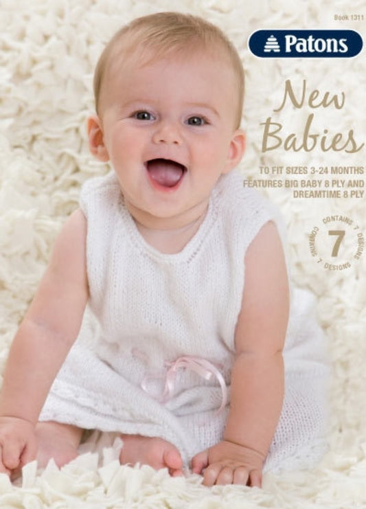 Smiling baby in a white knit dress sits on a fluffy white blanket. Text: "Patons New Babies" with knitting details, suggests warmth and softness.