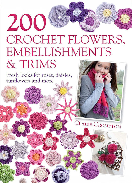 Cover of 200 Crochet Flowers, Embellishments & Trims, featuring a variety of colorful crocheted flowers and trims, including roses, daisies, and sunflowers, arranged around a photograph of a woman wearing a crocheted scarf. The title is displayed in bold red letters at the top.