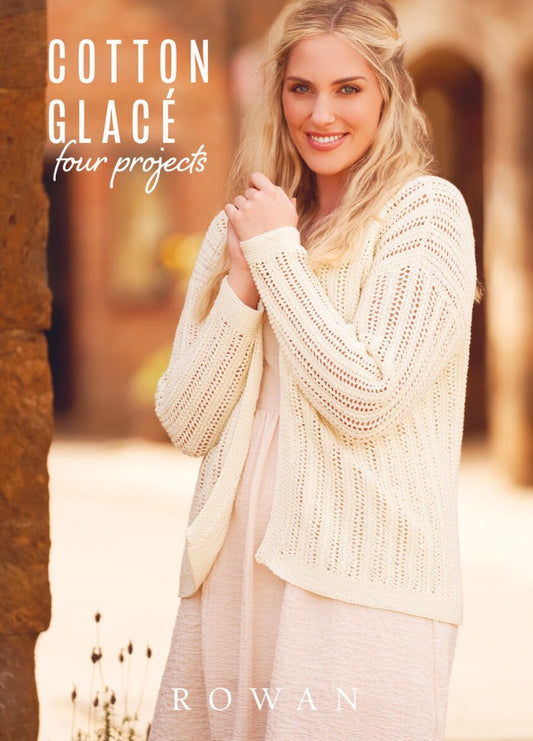 Smiling woman in a light, knitted cardigan stands outdoors, conveying warmth and comfort. Soft focus and earthy tones create a serene mood. Text reads "Cotton Glacé, four projects, Rowan."