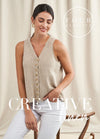 Woman in a beige knitted vest with buttons, seated on a wooden chair against a beige curtain backdrop. Text overlay: "Creative Linen." Calm and stylish tone.