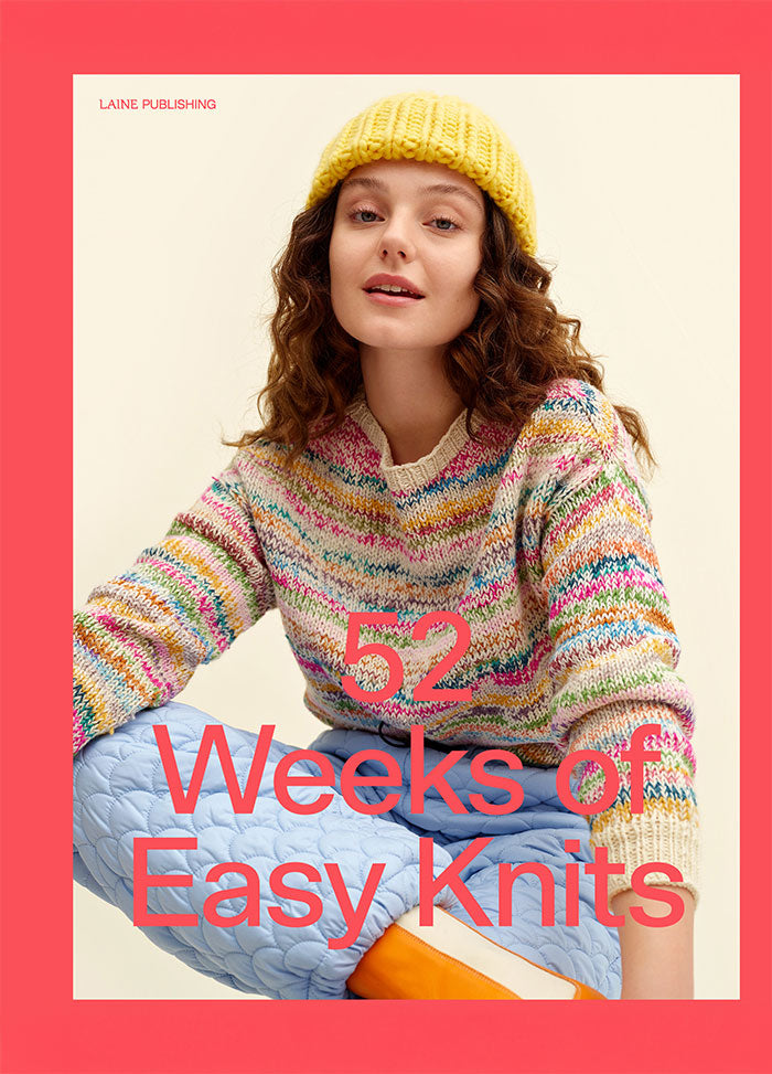 52 Weeks of Easy Knits: person wearing a colorful knitted sweater, blue quilted pants, and orange shoes; face obscured