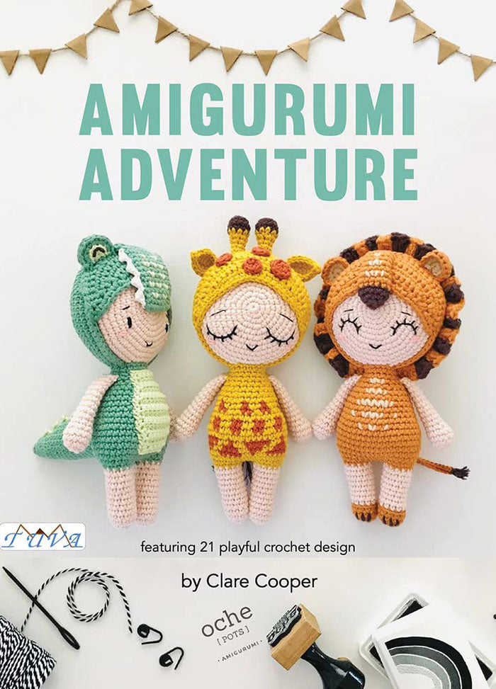 Cover of Amigurumi Adventures, showcasing three crocheted dolls: a dinosaur in a green outfit, a giraffe in a yellow dress, and a lion with a brown mane. The dolls are arranged side by side, set against a white background with festive bunting at the top and the title in bold green letters.