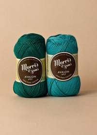 Two balls of "Morris' Yarn" label, made from 100% pima cotton, ideal for spring and summer knitting and crochet projects.