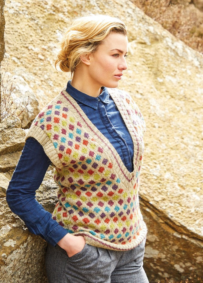 A Fair Isle sweater vest using six Felted Tweed colours in a diamond motif, featuring an exaggerated V-neckline, contrast edge stripes, and rib trims at neck, shoulders, and hem.