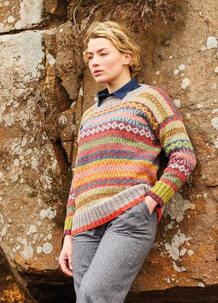 A multicolour Fair Isle pullover in five Felted Tweed shades, with a slash neckline and contrast tipping at cuffs and hem for a crisp finish.