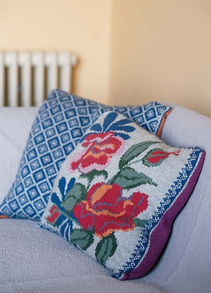 Britta rectangular cushion with a large vintage floral front and a striking geometric back; worked in Softyak DK.