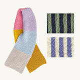 A multicoloured knitted striped scarf, displaying a variety of hues in a fashionable and dynamic pattern.