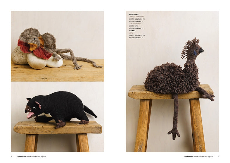 Three knitted animal figures are displayed on stools. A multicolored bird rests on stones, a black and white creature is below, and a brown bird perched on another stool adds a whimsical touch.
