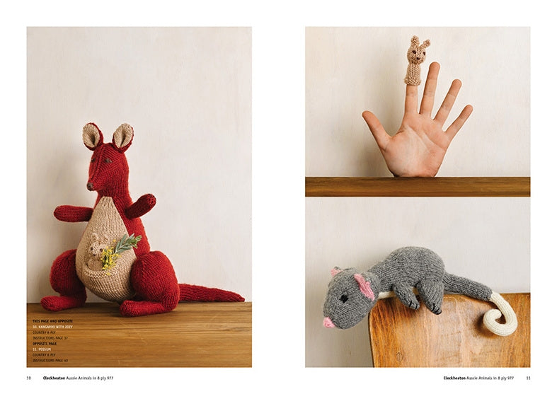 Handcrafted knitted animals on display. Left: a red and beige kangaroo with a yellow chick in its pouch. Right: a hand puppet kangaroo on a finger above a shelf, and a gray possum with a white tail on the shelf edge. Cozy and playful vibe.