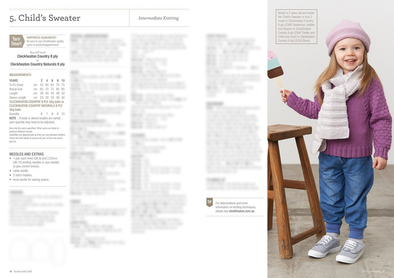 Smiling child in a purple sweater, pink hat, and scarf holds a toy ice cream bar, standing by a wooden stool. Knitwear pattern text on the left.