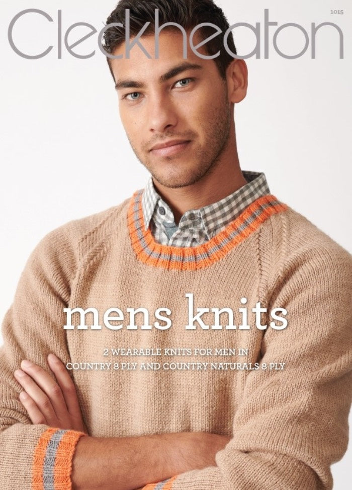 A man in a beige knitted sweater with orange and gray accents poses confidently with arms crossed, against a plain backdrop. The text reads "Cleckheaton: Mens Knits." The mood is warm and stylish.