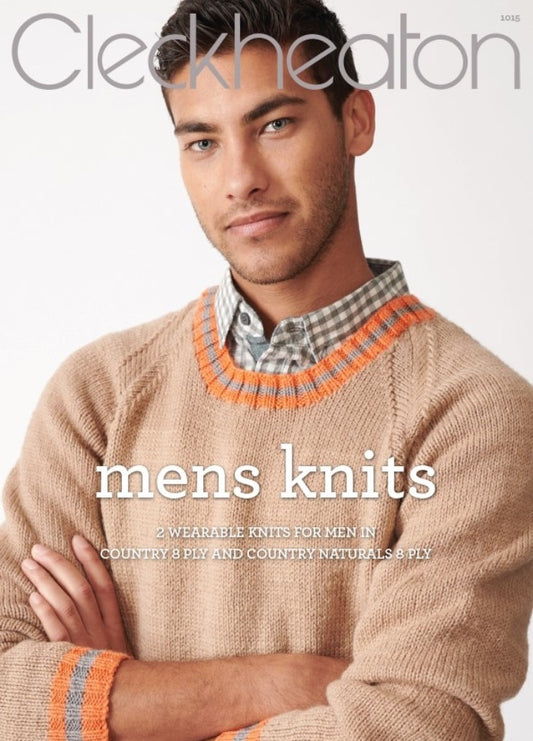 A man in a beige knitted sweater with orange and gray accents poses confidently with arms crossed, against a plain backdrop. The text reads "Cleckheaton: Mens Knits." The mood is warm and stylish.