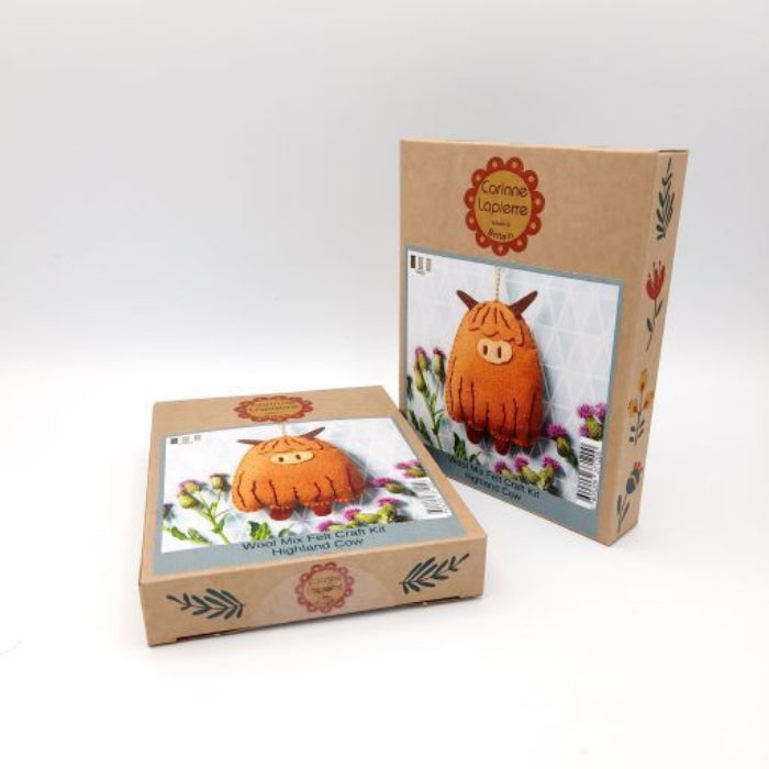 Two cardboard boxes with Highland Cow craft kit on a white background