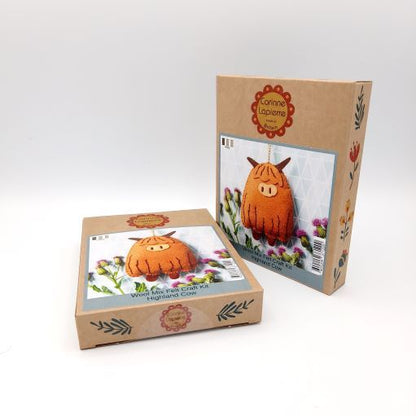 Two cardboard boxes with Highland Cow craft kit on a white background