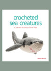 Cover of “Crocheted Sea Creatures” by Vanessa Mooncie, featuring a gray and white crocheted shark. The subtitle reads “A collection of marine mates to make,” highlighting the book’s focus on handmade ocean-themed designs.