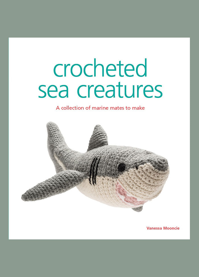 Cover of “Crocheted Sea Creatures” by Vanessa Mooncie, featuring a gray and white crocheted shark. The subtitle reads “A collection of marine mates to make,” highlighting the book’s focus on handmade ocean-themed designs.