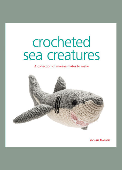 Cover of “Crocheted Sea Creatures” by Vanessa Mooncie, featuring a gray and white crocheted shark. The subtitle reads “A collection of marine mates to make,” highlighting the book’s focus on handmade ocean-themed designs.