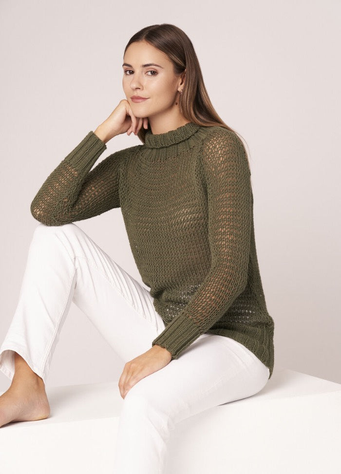 Soft cotton wrap with openwork pattern, draped over shoulders for a light summer layer.