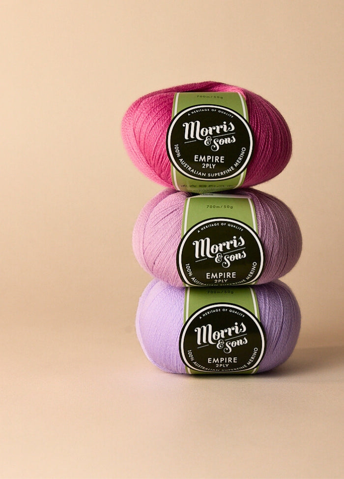 Three colourful balls of 100% superwash merino wool yarn, soft and smooth, ideal for babies and children’s projects.