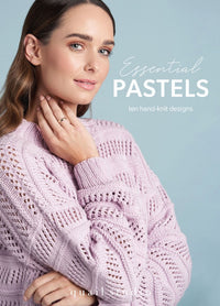Essential Pastels knitting pattern book cover by Quail Studio for Rowan, featuring a model in a soft pastel knit top made with Summerlite DK yarn, photographed in a bright, summery setting.