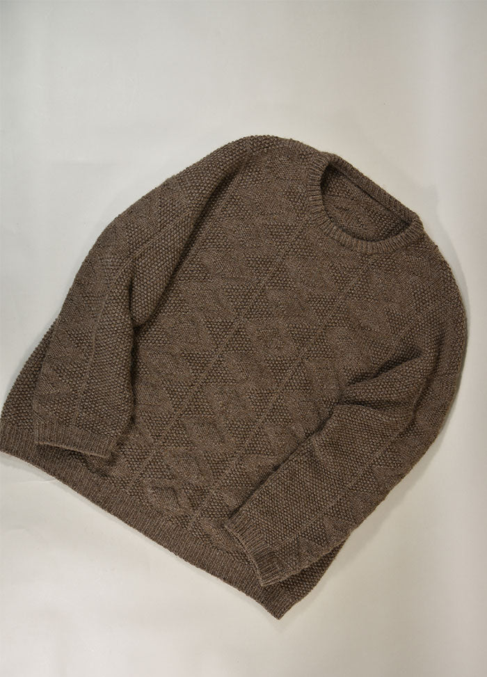 Flat lay of the Esther Sweater in brown knit with diamond texture, ribbed cuffs, hem, and neckline, displayed on a light surface.