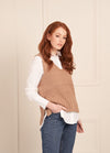 Crochet tunic with side slits and relaxed fit, styled with jeans and boots.
