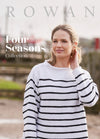 A woman smiles gently while wearing a white sweater with black stripes. "Rowan Four Seasons Collection" text overlays. Background is slightly blurred.