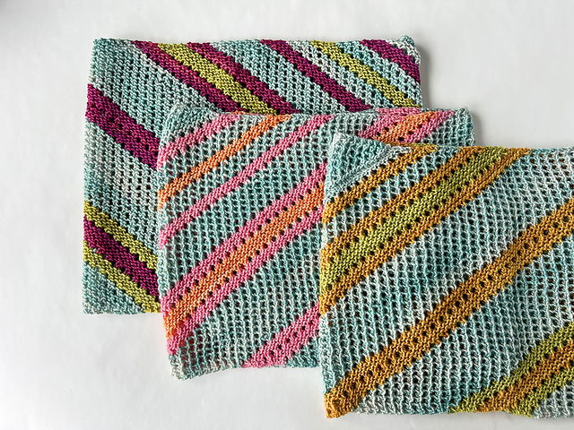 Friends and Family Cowl, hand-knit in light blue with diagonal stripes in pink, yellow, orange, and green; three cowls shown.