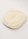 A white ball of Australian roving yarn on a white background, highlighting its fine Merino fibers and soft appearance.