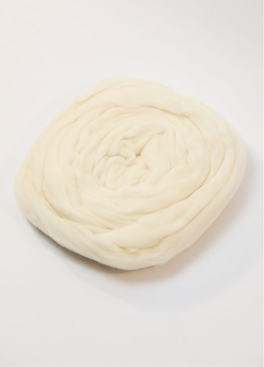 A white ball of Australian roving yarn on a white background, highlighting its fine Merino fibers and soft appearance.
