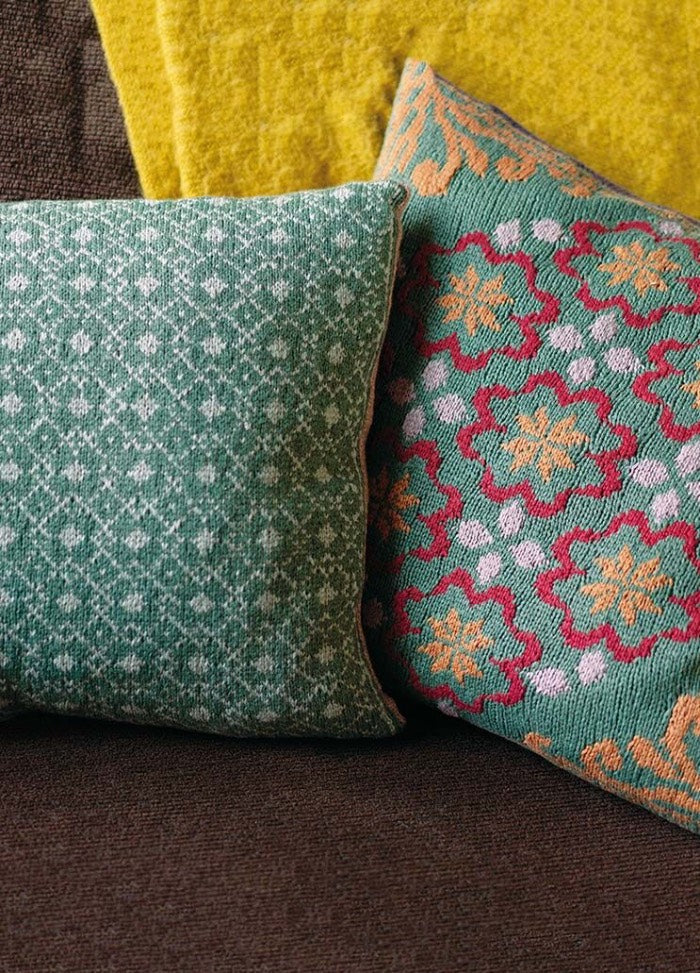 Greta cushion featuring a traditional Norwegian motif; front pairs with any coordinating back from the collection; knit in Softyak DK.