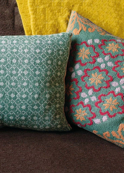 Greta cushion featuring a traditional Norwegian motif; front pairs with any coordinating back from the collection; knit in Softyak DK.