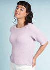 Hyacinth knitting pattern from Essential Pastels, a feminine pastel pullover with floral-inspired lace accents.