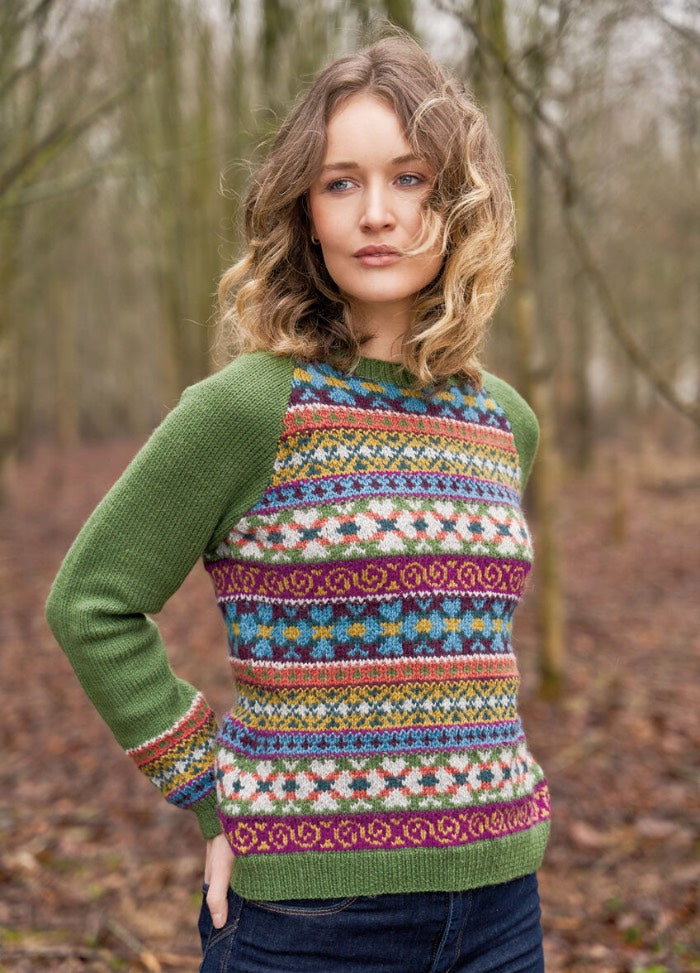 Vibrant Fair Isle pullover with layered bands of colourwork across body and cuffs; plain raglan sleeves and crew neck; worked in eight shades of Alpaca Soft DK.