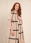 Long crochet scarf with vertical stripe accents, styled for warmth and modern flair.