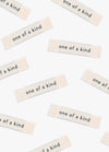 One of a Kind Sew-in Labels scattered