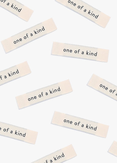 One of a Kind Sew-in Labels scattered