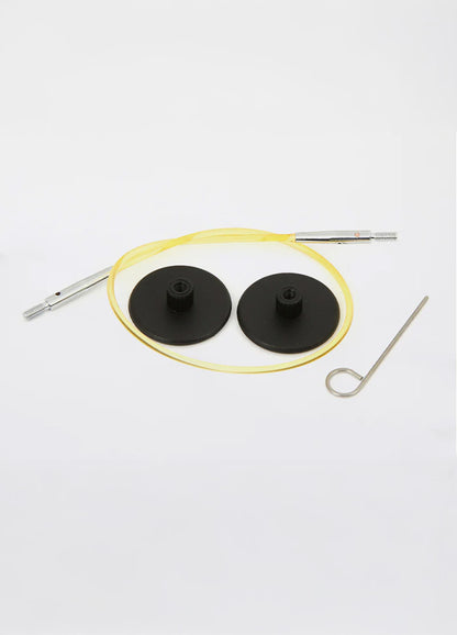 Interchangeable yellow and black cables with a screw, suitable for KnitPro tips, ensuring a secure connection for knitting.
