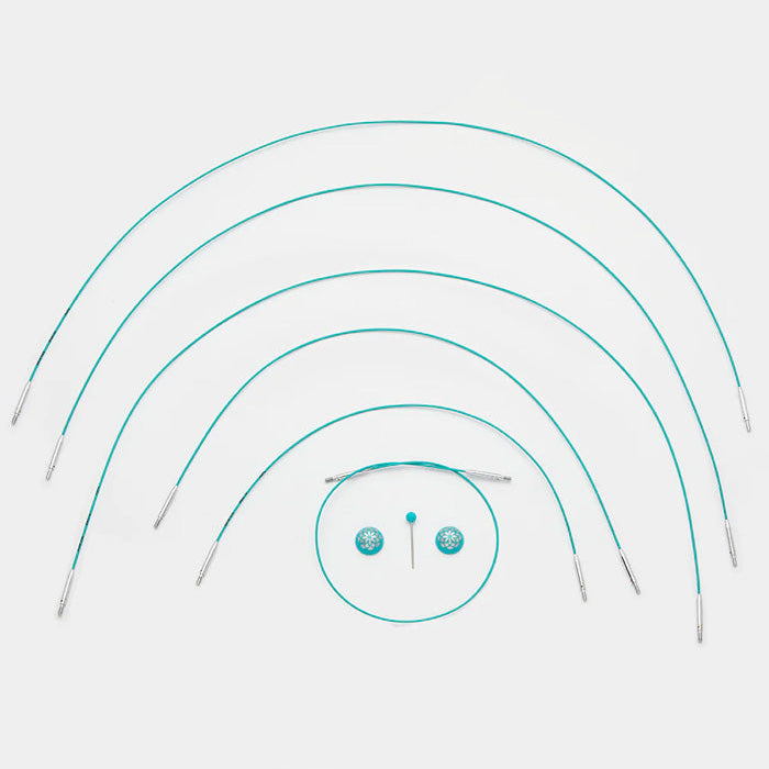 A set of teal knitting cables with a central circle, featuring a smooth coating and available in multiple lengths for easy knitting.