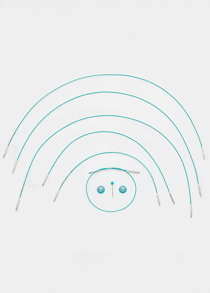 A set of teal knitting cables with a central circle, featuring a smooth coating and available in multiple lengths for easy knitting.