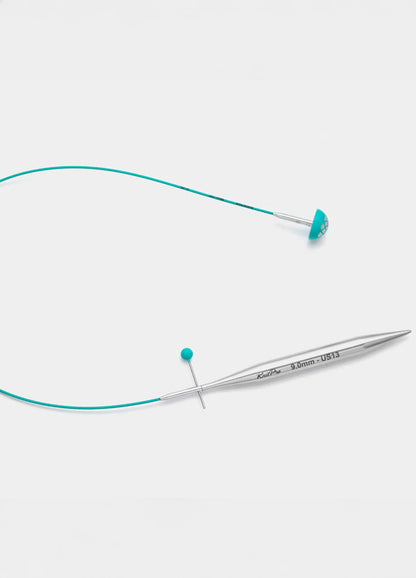 A knitting cable with a blue cord, crafted for precision cutting, featuring a teal smooth coating and flexible material.