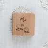 Charming wooden tape measure with a sheep and heart motif, combining contemporary style with everyday utility.