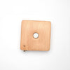 Square beechwood tape measure with sheep designs, 150cm/60" long, retractable via a button in the center.