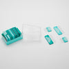 A set of teal knit blockers , some in a clear plastic case and four placed separately on a white surface.