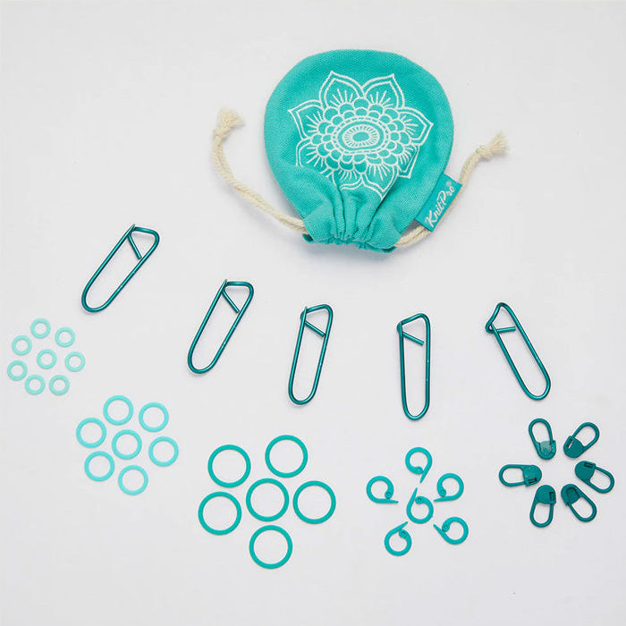 A teal cloth bag filled with 100 color-coded stitch markers and a separate bag of paper clips for easy organization.
