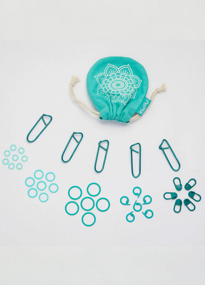 A teal cloth bag filled with 100 color-coded stitch markers and a separate bag of paper clips for easy organization.