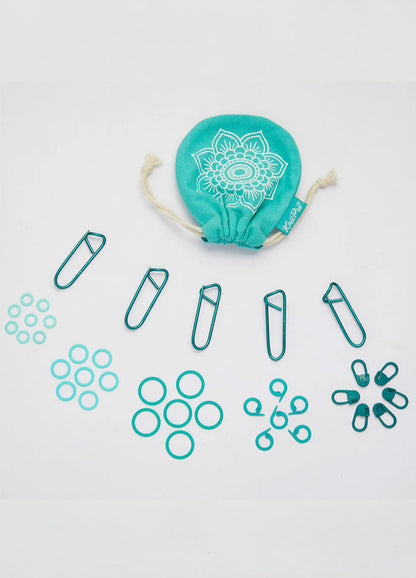 A teal cloth bag filled with 100 color-coded stitch markers and a separate bag of paper clips for easy organization.